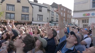 Thousands of BUNS thrown from County Hall to celebrate King's coronation in Oxfordshire