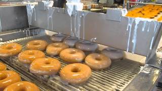 Krispy Kreme Doughnuts Being Glazed