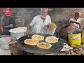 hardworking old man selling desi organic breakfast on footpath early morning lahori food