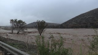 Floodwater overflows road entering city of Volos | AFP