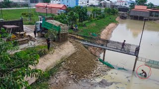 Action Building road temporary crossing the pond to easy prepare rebuild lion bridge