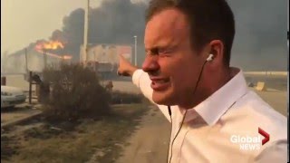 'This is as bad as it gets': Super 8 hotel burns behind Global News reporter during broadcast
