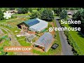 Sunken greenhouse wraps home & feeds suburban antifragile co-op