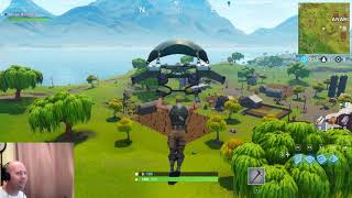 fortnite rocket aftermath anarchy acres - suche zwischen einem teich einer windmahle und einem schirm fortnite
