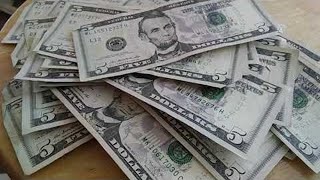 Stacks of $5 dollar bills!