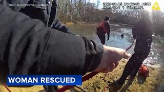 Firefighters rescue woman and 2 dogs from frozen creek