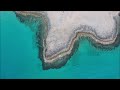 huge green turtles chelonia mydas mate on the beach of ronnas – drone video –karpasia cyprus 2023