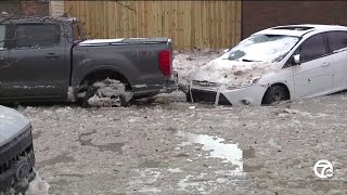 Streets of Southwest Detroit lined with dead, frozen cars after major flooding