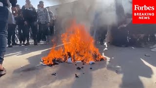 Freed Palestinian Prisoners Burn Their Uniforms After Being Released From An Israeli Military Prison