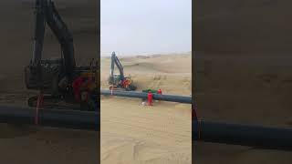 Desert gas pipeline installation scene