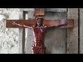 carving a jesus christ on cross wood sculpture