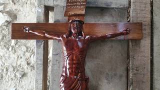 Carving a Jesus Christ on cross / wood sculpture