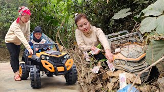 The girl picked up the remote control car and the bag of money, then brought the car back for repair