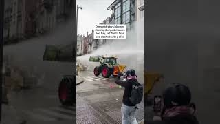 Farmers smash through police barricades and dump manure in protest over EU polic