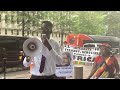 Tonny the Ugandan team leader speaking at the Washington DC rally.