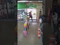 Would-be robber gives beer back to cashier after trying to escape through locked door in Australia