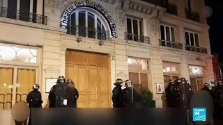 Paris protesters try to enter theatre attended by Macron