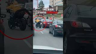 Biker kicks car during Road Rage