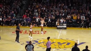 Lakers fan makes a HALF COURT SHOT for $100,000!