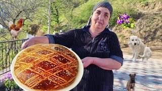 GRANDMOTHER BAKES KARABAKH BREAD IN THE FOREST