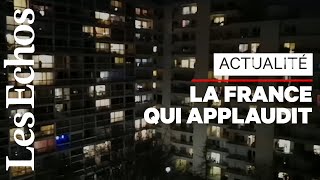 De leurs balcons, des Français applaudissent le personnel soignant