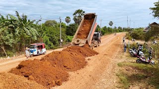 Fantastic Action! Dump truck unloading soil to build best layer for road construction push by D41A