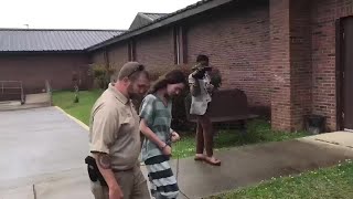 Denise Frazier perp-walk into court