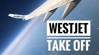 WestJet taking off from Kelowna International Airport YLW