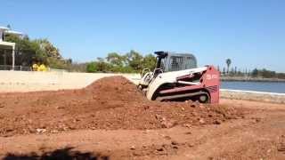 TAKEUCHI TL150 Rubber track loader doing what it dose best moving dirt