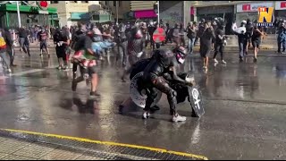 Riot police and water cannon in force as protesters march in Chile