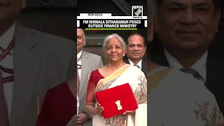 FM Nirmala Sitharaman poses outside Finance Ministry ahead of presenting Union Budget 2025