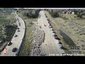 crowd watches on as over 2500 sheep cross idaho highway