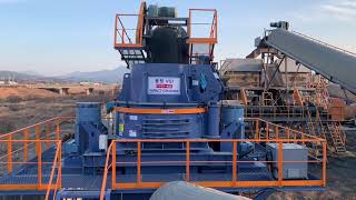 Yong Won - YVSI-440 Vertical Shaft Impact Crusher (440kW, 1600rpm, Rock on Anvil) operating at site.