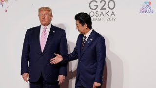 'Look at me’: Trump and Abe's awkward handshake