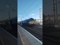 class 66 speeds past warrington bank quay 08 08 23