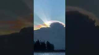 Strange Rainbow seen in China.Rainbow coloured scarf cloud above  Chinese city of Haikou