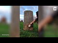 kind hearted woman cleans old gravestones