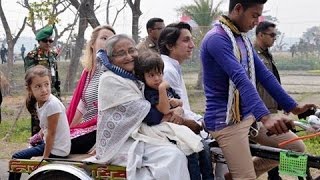 A Prime Minister visits her own village by rickshaw van and walking