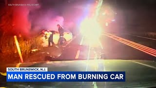 Dramatic video shows NJ police pull driver from car fire in harrowing rescue