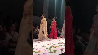 Beautiful models in exquisite designer sarees doing rampwalk at a fashion show