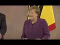 moment former german chancellor angela merkel receives order of merit