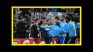 Patrice evra sent off for kicking fan in the head before europa league tie