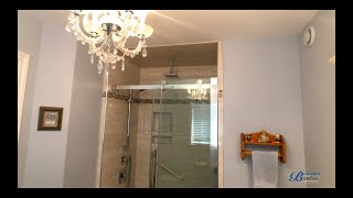 Grand Ensuite Bathroom Design with Large Vanity and Custom Tile Shower