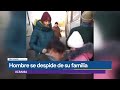 un padre se despide de su familia antes de enviarla fuera de ucrania