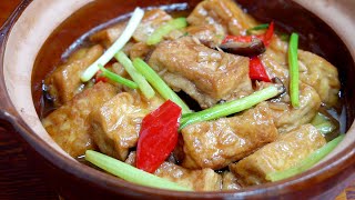 soup with tofu cooked in the clay pot .  so delicious