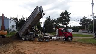 Mack End Dump Hauls to Case Excavator