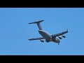 us airforce c 17 aircraft passes overhead showing off landing gear