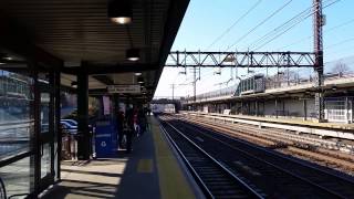 A wrong-railed reverse Metro North consist meets Amtrak 162 in Larchmont