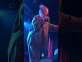 Billie Eilish gives water to a fan who's about to pass out during Ocean Eyes