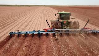 John Deere 8320R pulling Sam Stephen’s 16 row rod weeder